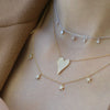 diamond layering necklace on model 